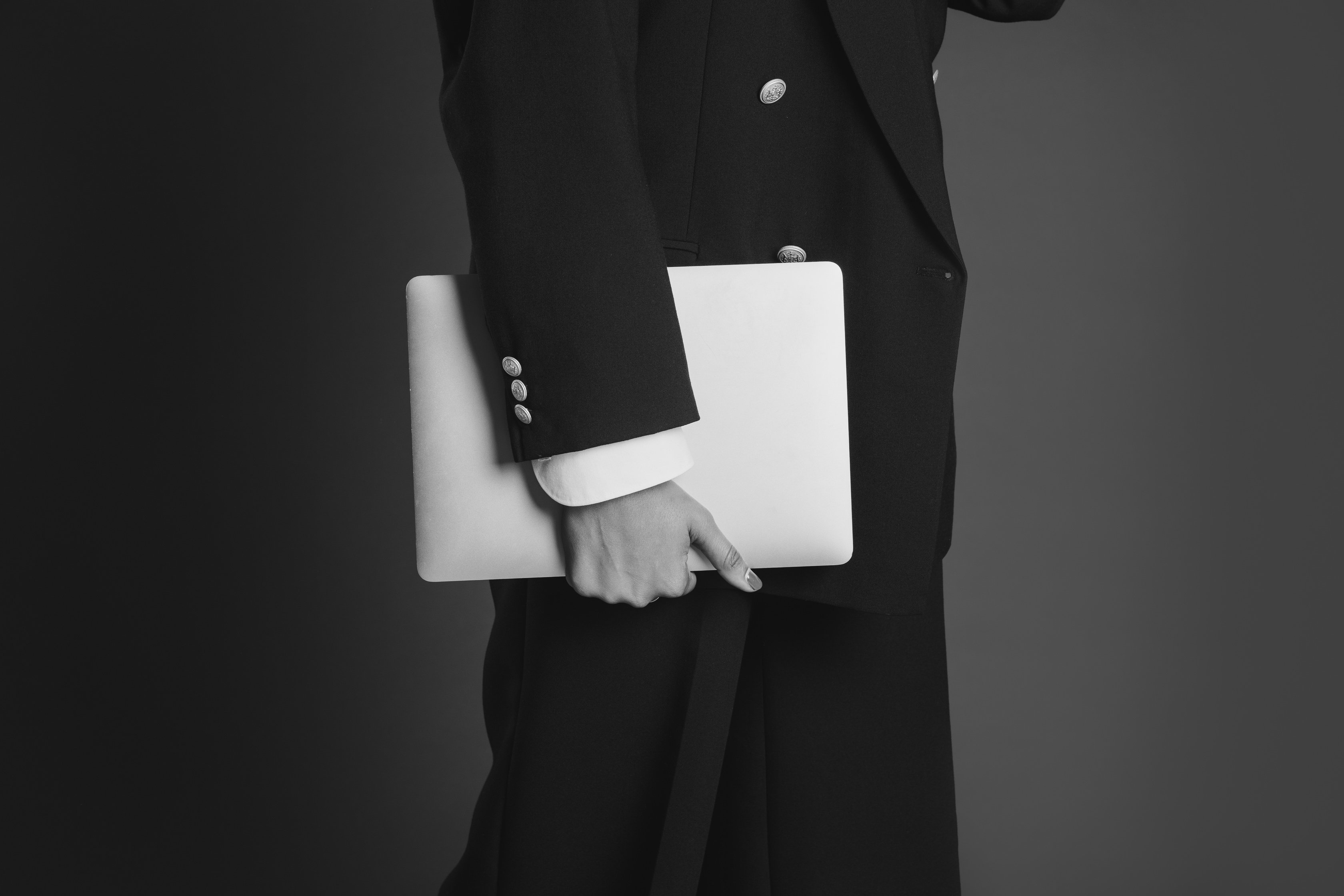 Stylish Woman Holding a Laptop